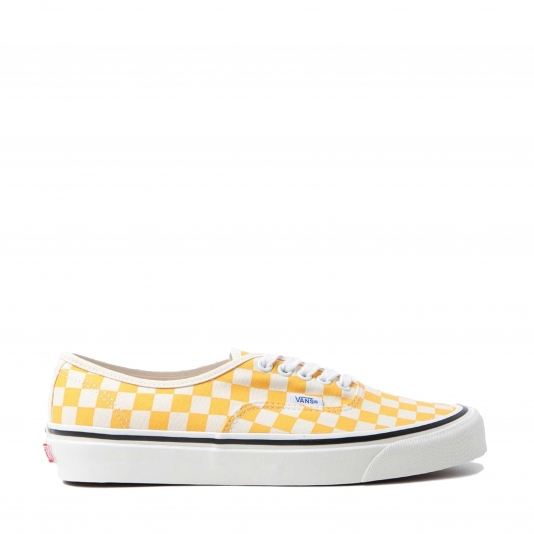 Yellow and cheap white checkerboard vans